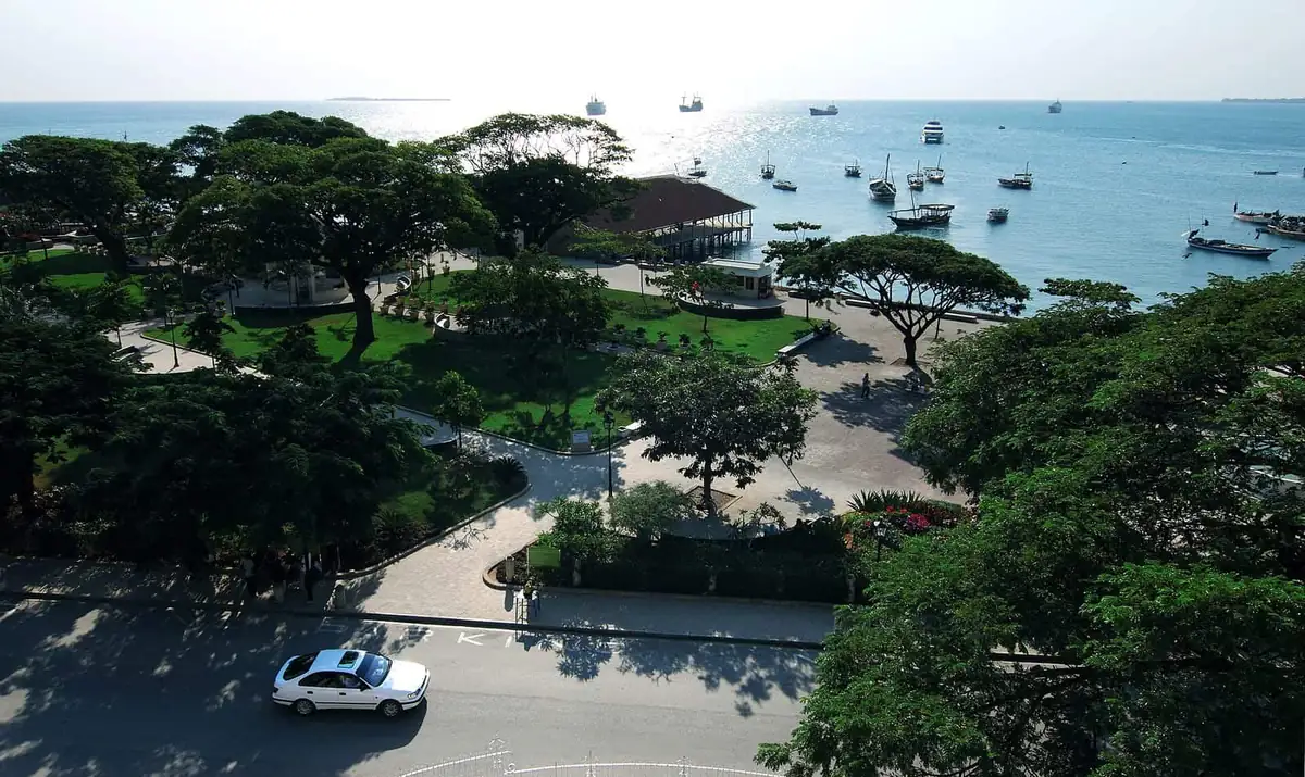 Forodhani Gardens and boats on the water at Stone Town seafront in daylight